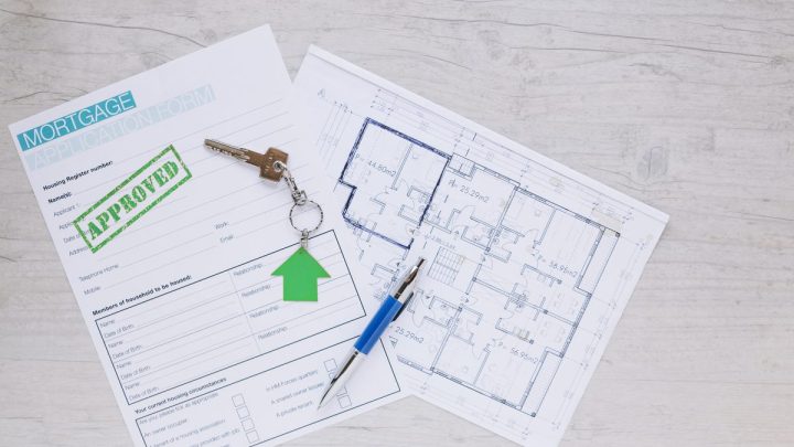 House blueprint drawing laid out with a property finance form