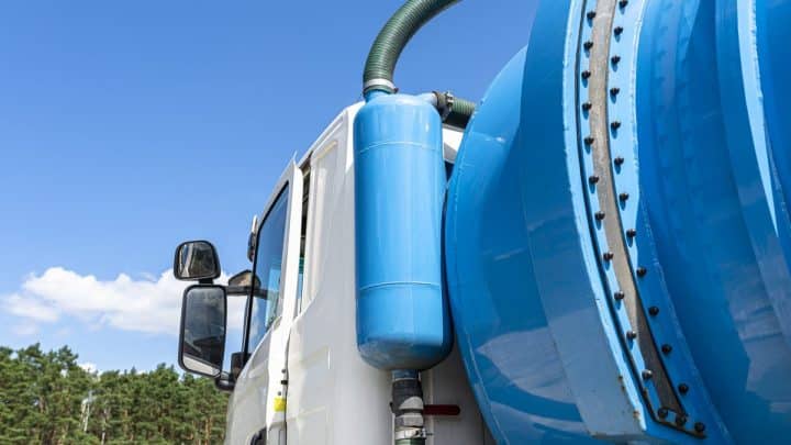 Septic vacuum truck showing fill indicator and overflow valve fittings