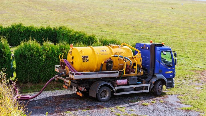 Sewage vacuum tanker truck parked for a pump-out job