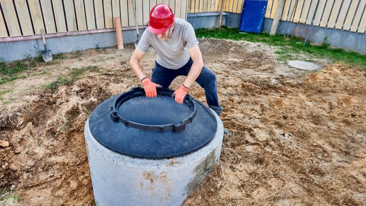 Fiberglass riser ring fitted under a septic tank manhole cover