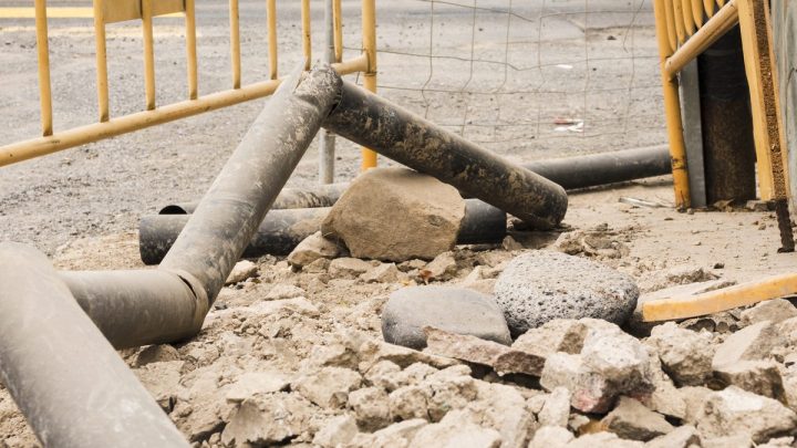 Open excavation with buried pipes and disturbed soil
